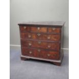 An 18th century walnut chest of drawers with a later base 93 x 103 x 58cm