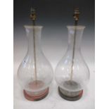 A pair of baluster glass bubble form lamps