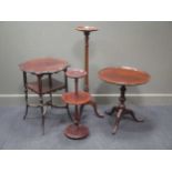 An Edwardian mahogany occasional table together with a mahogany wine table and two torchere