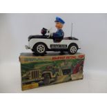 A rare boxed Japanese tinplate battery powered Highway Patrol Jeep by Daiya, with flashing gun,