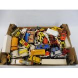 A large box of mixed die-cast model cars and commercial vehicles.