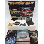 A boxed Scalextric 300 electric model racing set plus an electronic lap counter and timer.