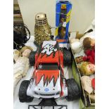 A boxed Pelham Puppet Thunderbird figure, a Chinese plastic dalek and a remote controlled car.