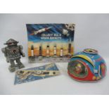 A Japanese tinplate UFO in excellent condition, plus a Space Navigator wrist mounted compass and a