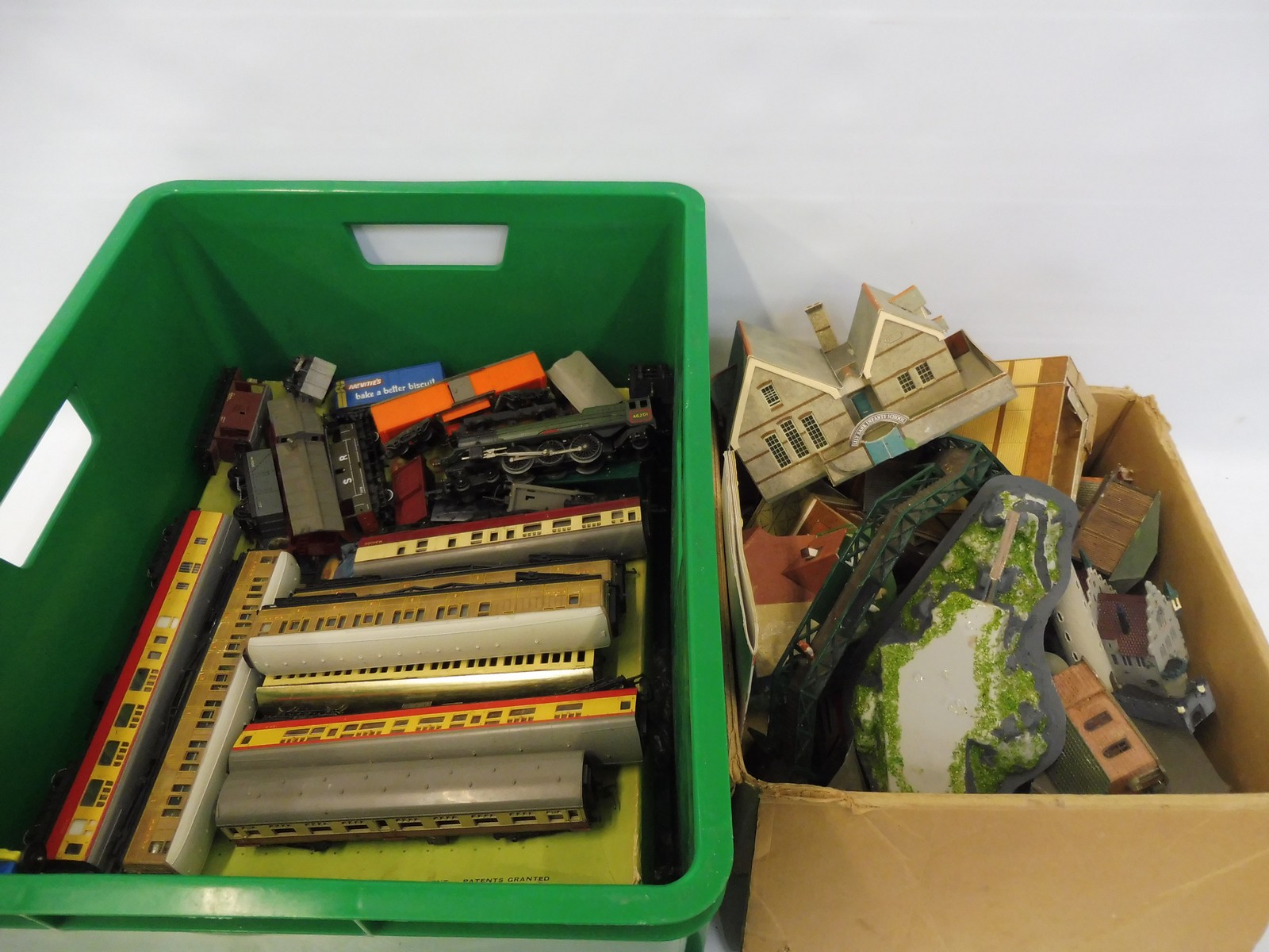 Two boxes of assorted model railway components including rolling stock, locomotive etc.