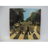 The Beatles Abbey Road LP with misaligned apple on reverse to the sleeve plus drain hole cover on