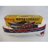 A boxed Tri-ang clockwork Motor Lifeboat.