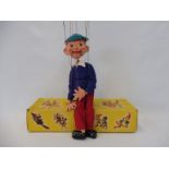 A boxed Pelham puppet 'Boy', late 1960s in generally good condition, original strings and