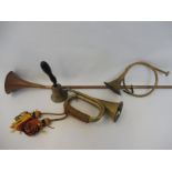 A military brass bugle with rope grip and tassels, plus a copper hunting horn, one other and a