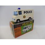 A boxed Japanese battery powered 'Non-Stop Mystery Action' Mercedes Police Bus, by repute in working