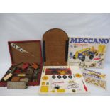 A boxed Meccano Motorised Construction Kit no.4, a wooden cased Meccano set and a shove ha'penny