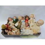 Six early composite headed dolls, a small German bisque headed doll, a selection of miniature