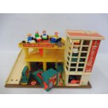 A Fisher Price garage complete with ramp, cars and figures.