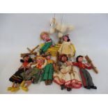 A box of seven assorted Pelham puppets, all string including Mexican Girl plus a boxed 'Poodle'.