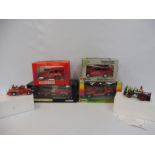 A collection of boxed die-cast models of emergency vehicles including a Burago 1/24th scale