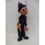 A boxed Pelham puppet 'Policeman', window box, mid 1970s, still retaining truncheon and foil on