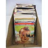 A box of 45s covering 1970s, 1980s, 1990s to include Blur, Talking Heads, Billy Bragg etc.