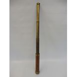 A German four drawer lacquered brass and mahogany telescope.