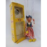 A boxed Pelham puppet 'Dutch Girl', early 1970s in original cellophane box, lovely hair, original