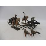 A WWI German tinplate field gun and carriage plus riders etc.