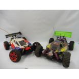 A G.S. Racing CV cage 4WD nitro buggy remote controlled car and a Hobao Hyper 7 1/8 4WD nitro.