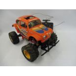 A Tamiya 58060 electric Hump Backed Monster Beetle, with controller.