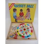 A Chad Valley Basket Ball tinplate game of colourful design, plus a Merit Dapper Dan magnetic game.