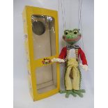 A boxed Pelham puppet 'Frog', late 1960s in cellophane box, individual toes version, in super