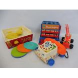 A selection of Fisher Price including a fire engine and a record player, complete.