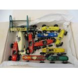 A box of early Matchbox racing cars, Dunlop stand etc.