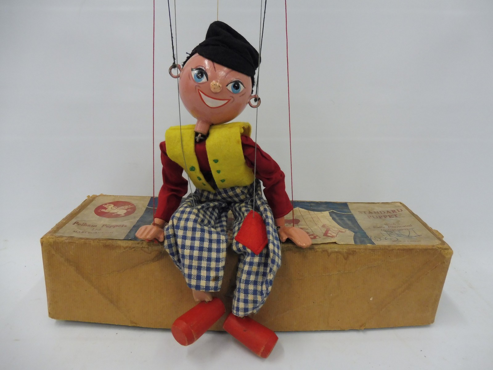 A boxed Pelham puppet 'Fritzi', small area of damage to the nose, original strings, controller and
