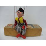 A boxed Pelham puppet 'Fritzi', small area of damage to the nose, original strings, controller and