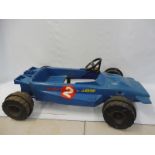 A 1970s 'Team Raleigh' plastic car in the form of a Formula 1 racing car.