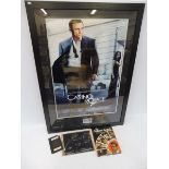 A selection of James Bond related items including a passport that was almost certainly used as a