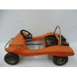 A 1970s plastic pedal car in the form of a VW 'Beach Buggy'.