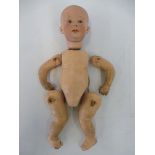 An unusual German bisque headed baby doll, head stamped 6894, plus body parts.