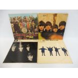 Four Beatles LPs comprising Sergent Pepper, Beatles For Sale, Help and With the Beatles, all early