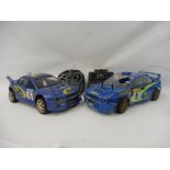 A Tamiya Subaru rally 4WD nitro remote controlled car with controller plus a Thunder Tiger rally