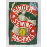 A Singer Sewing Machines pictorial enamel sign by Patent Enamel, in excellent condition, 24 x 36".