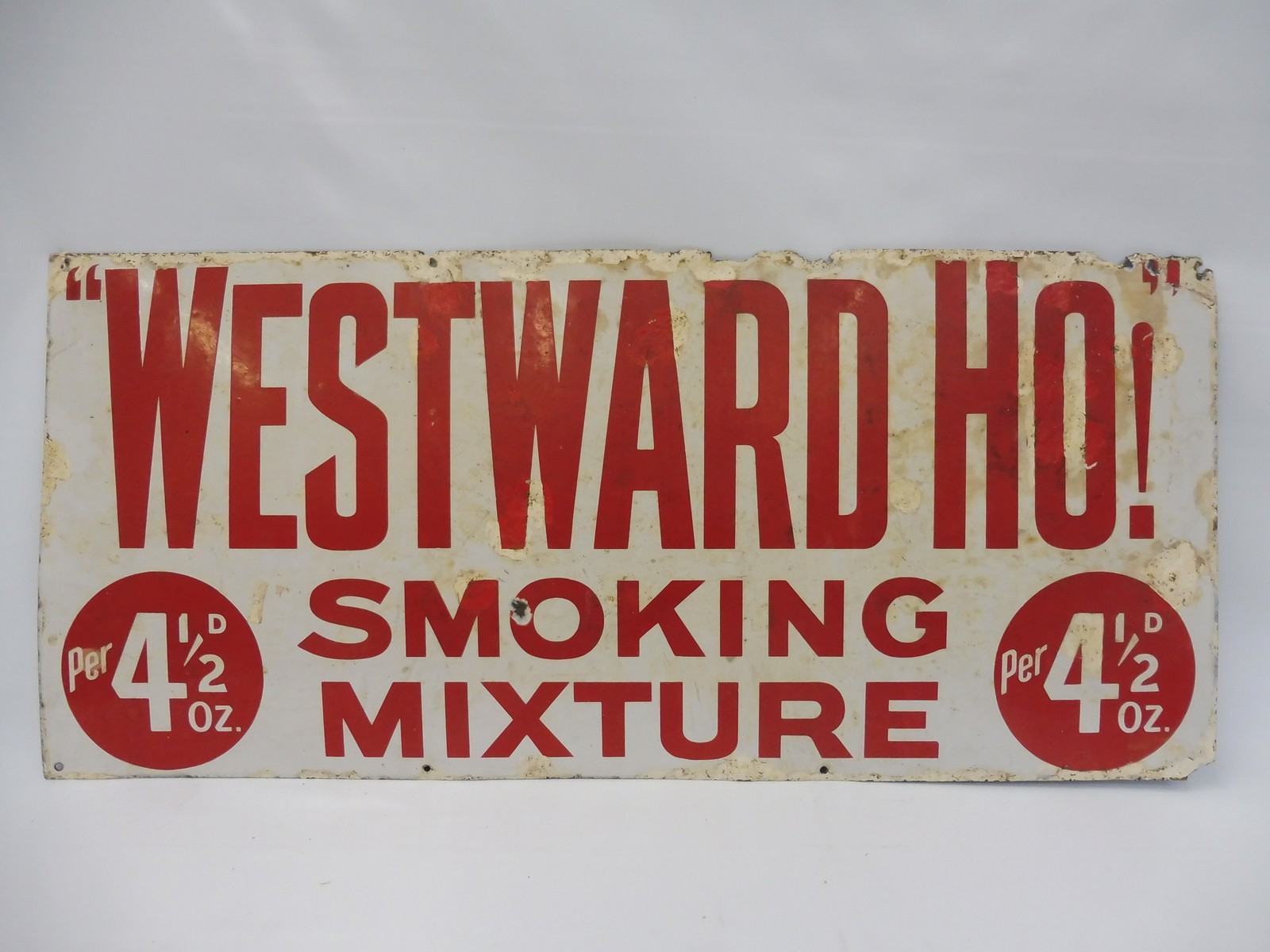 A Westward Ho! Smoking Mixture rectangular enamel sign with older amateur retouching, 40 x 18".