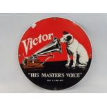 A reproduction Victor 'HMV' circular enamel sign, 11 1/4 x 11 1/4".