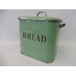 A green enamel bread bin.