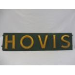 A Hovis horizontal sign of gilded letters on a dark green background, 65 1/2 x 16" including