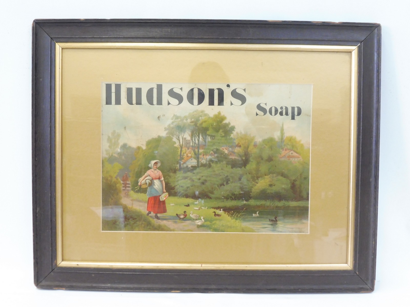 An oak framed and glazed Hudson's Soap pictorial showcard printed by W.H. Smith & Son with Hudson'