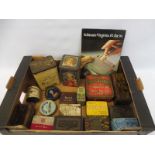 A quantity of mixed advertising tins, plus a smoking related showcard.