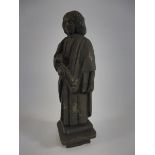 A very heavy bronze figure of a robed gentleman, unusually with a slot to the reverse, 7 1/2" h.