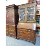 A George III mahogany bureau bookcase, the astragal glazed upper section having reeded half