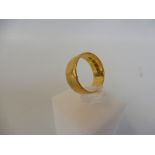 A 22ct gold wedding band, weight approx. 8g.