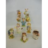 A collection of Beatrix Potter figures - Timmy Willie, Little Pig Robinson, Ribby, Goody Tiptoes,