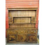 A Georgian West Country oak, ash and elm dresser with a cupboard base, 67" w x 78 1/4" h x 19 1/4"